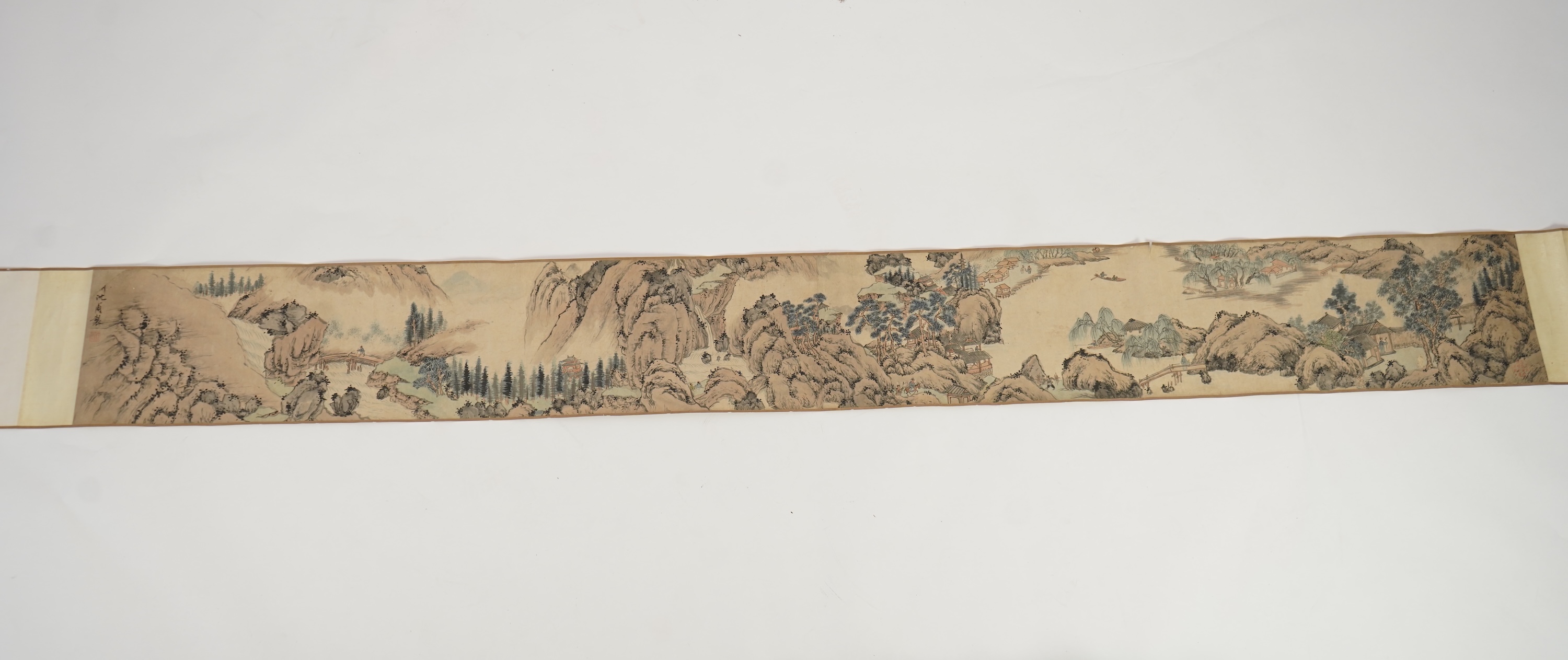 Chinese School , (Qing dynasty), Figures in a mountainous river landscape, Ink and colour on paper handscroll, 268.5cm x 29cm excluding borders